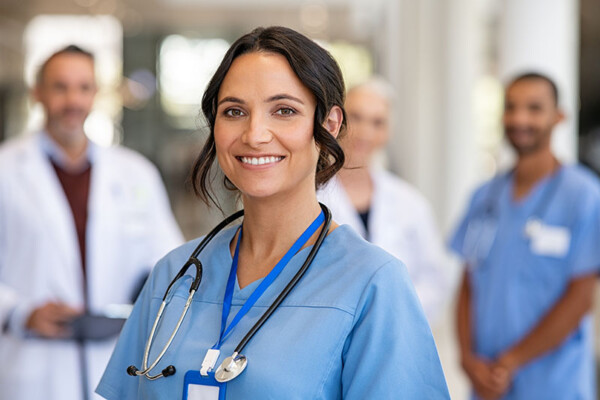 Successful team of doctor and nurses smiling. 